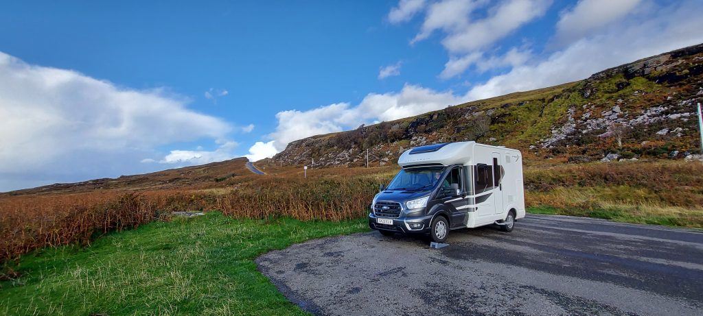 Photograph of a van parked up in the Scottish highlands