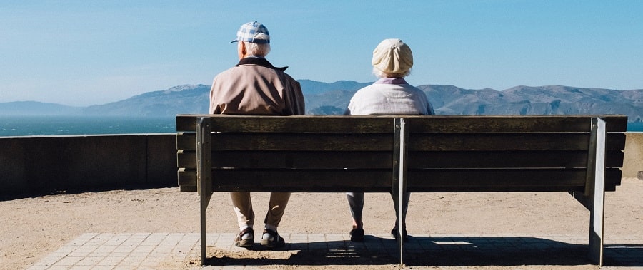 old people sitting on a bench